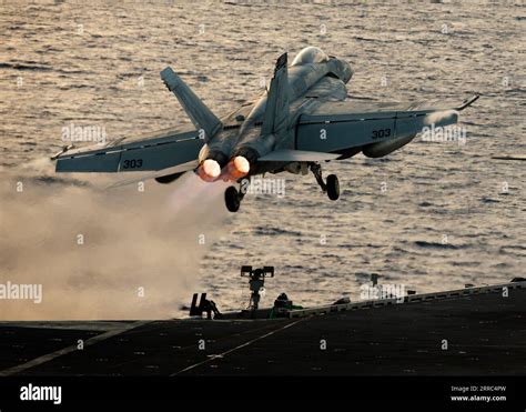 An F A 18E Super Hornet Launches From The Flight Deck Of USS Gerald