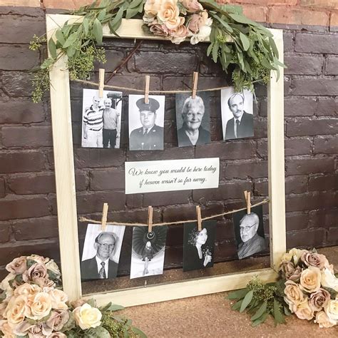 An Old Photo Frame Is Decorated With Flowers And Greenery To Hang On