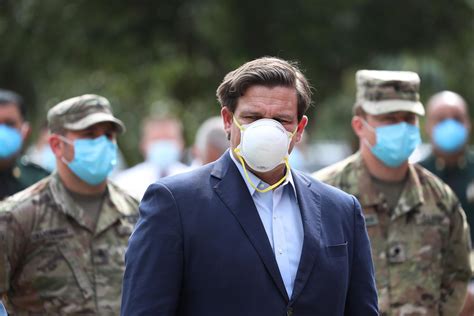 Florida Gov. Ron DeSantis has no idea how to wear a protective mask.