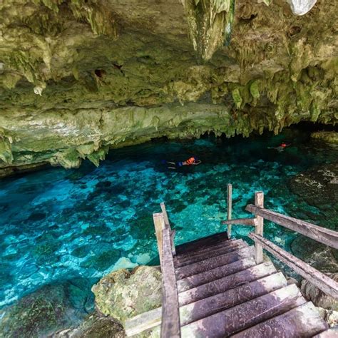 Cenote Dos Ojos in Quintana Roo, Mexico. People swimming and snorkeling ...