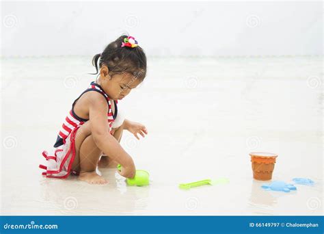 Little Asian Girl Playing In The Sand Stock Image Image Of Colorful