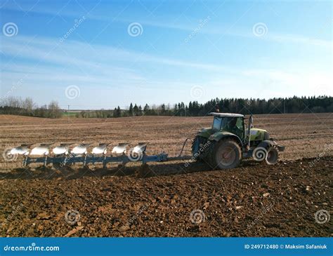 Tractor With Plow On Soil Cultivating Stock Photo Image Of Agronomy