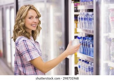 Smiling Pretty Blonde Woman Taking Water Stock Photo 299375342