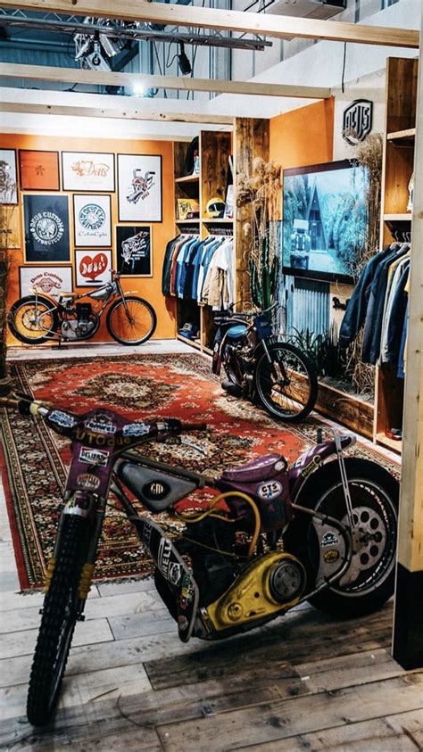 A Motorcycle Parked Inside Of A Store Next To A Rug And Other Items On