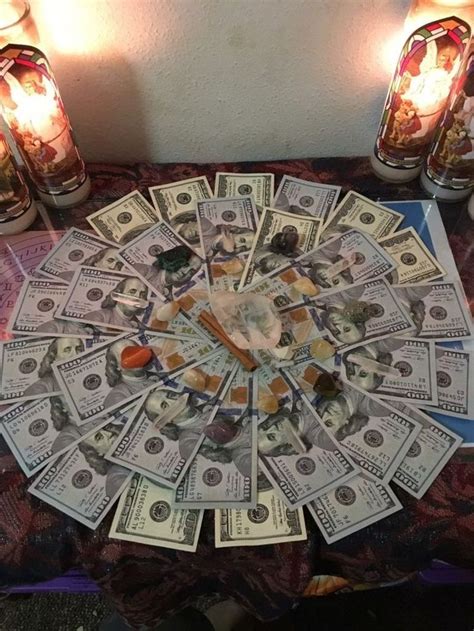 A Bunch Of Money Sitting On Top Of A Table Next To Some Candles And Jars