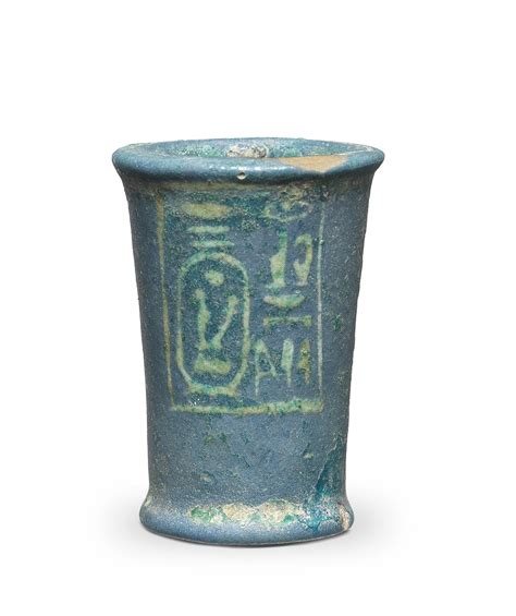 An Egyptian dark blue glazed faience offering vessel naming Seti I ...