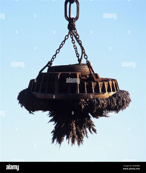 magnetic grab on crane lifting metal at scrapyard uk Stock Photo, Royalty Free Image: 34985524 ...