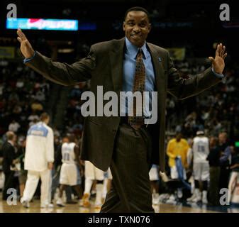 Knicks Head Coach Isiah Thomas Stares Into The Crowd During An NBA