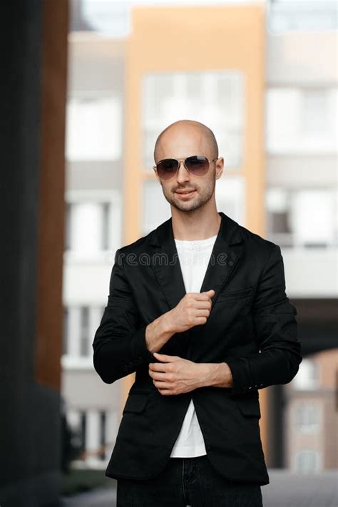 Beautiful Mature Bald White Man In Sunglasses And A Fashionable Jacket