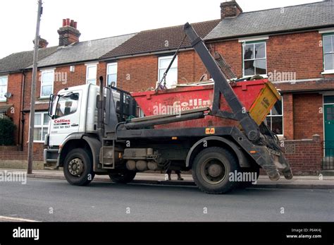 skip loader collecting  skip stock photo alamy