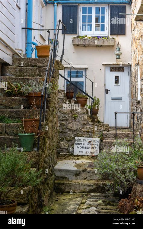 A typical Cornish fishing village on the Coast of cornwall with old ...