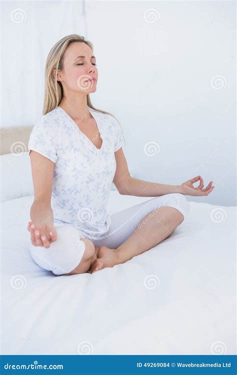 Blonde Woman Sitting In Lotus Pose In Bed Stock Photo Image Of Homey Blonde 49269084