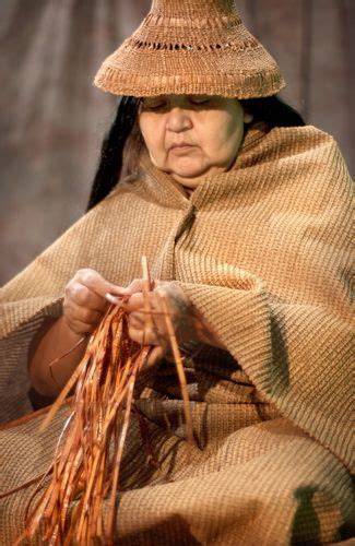 A Women Weaving Cedar And Wearing A Cedar Hat American Indigenous