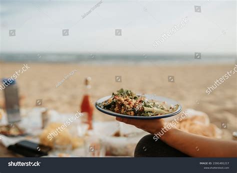 Person Holding Plate Meal On Beach Stock Photo Shutterstock