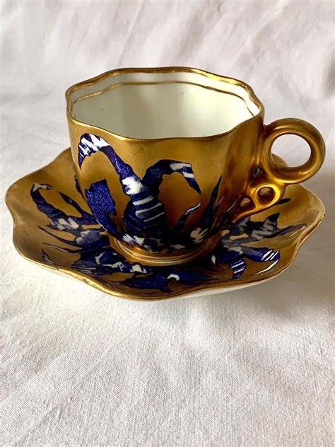 An Antique English Coalport Porcelain Gilded Demi Tasse And Saucer