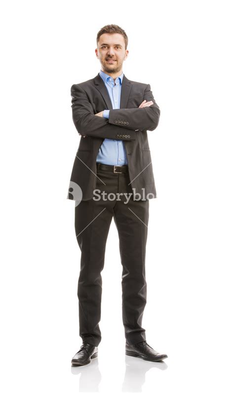 Successful Business Man In Suit Is Posing In Studio Isolated Over White