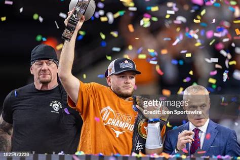 Texas Longhorns quarterback Quinn Ewers lifts the Big 12 championship... News Photo - Getty Images