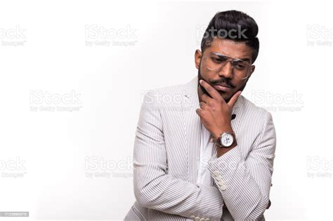 Young Indian Hipster Confused Man Scratching His Chin Isolated White