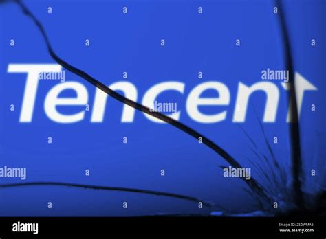 Tencent Logo Is Visible On The Broken Glass Tencent Holdings Ltd Is A