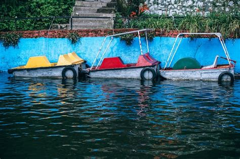 Premium Photo Boats Moored In Lake