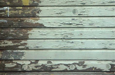 Peeling paint from moisture coming through the wooden siding | Fixing Our Historic House