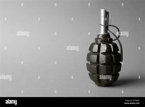 hand grenade  grey background space  text stock photo alamy