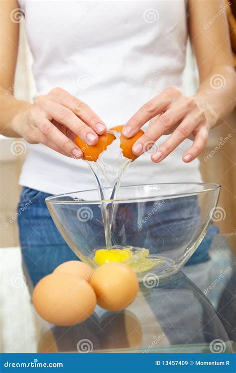 Female Hands Breaking Eggs Into A Bowl Stock Image Image Of Cooking