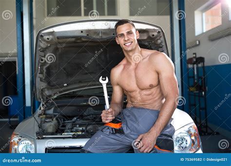 Handsome Muscular Mechanic With A Tool Stock Photo Image Of Person