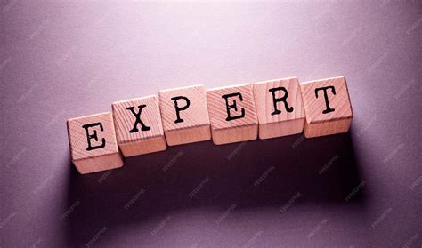 premium photo expert word  wooden cubes