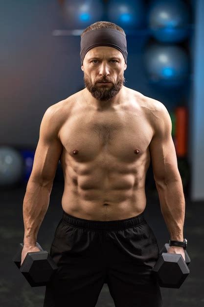 Premium Photo Brutal Sexy Serious Man Athlete With Naked Pumped Torso