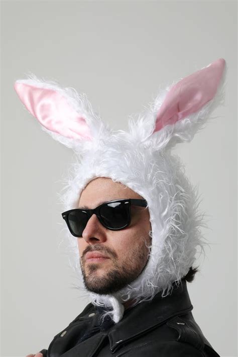 Vertical Portrait Of Bearded Man Wearing Bunny Ears And Sunglasses