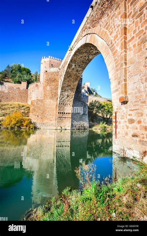 Toledo, Spain. Alcantara Bridge ( Puente de Alcantara ) is an arch ...