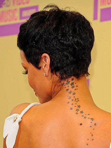 Rihannas Tattoos Rihanna Has A Cluster Of Stars Tattooed Down Her