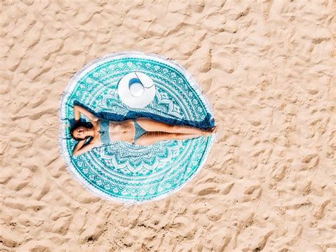 Aerial Drone View Of Woman In Swimsuit Bikini Relaxing And Sunbathing