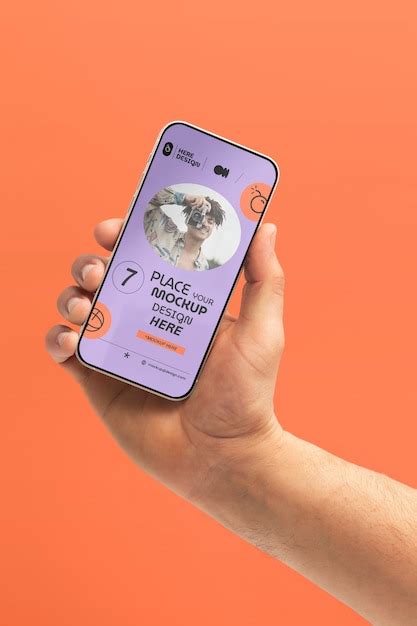 Premium PSD Hand Holding Smartphone Mockup