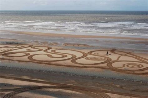 Evewright Creates Massive Sand Drawings Using The Beach As A Canvas