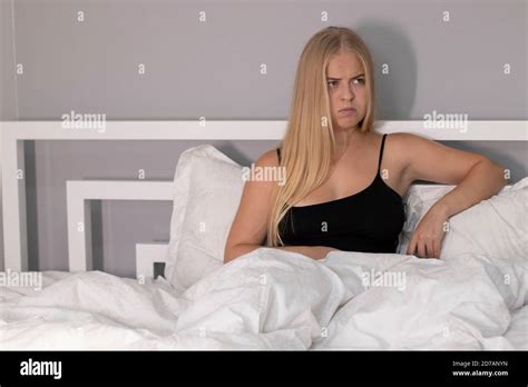 Angry Blonde On White Bed Problems Quarrel Stock Photo Alamy