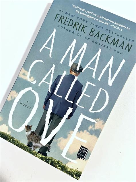 A Man Called Ove Is Standing In Front Of A Book Cover With A Cat