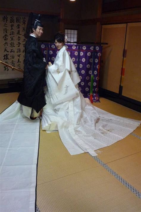 A Couple Dressed In Heian Robes At A Junihitoe Photography Experience