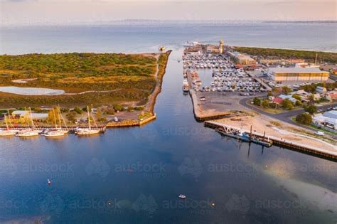 Image of Aerial view of narrow channel joining a marina and the ocean ...