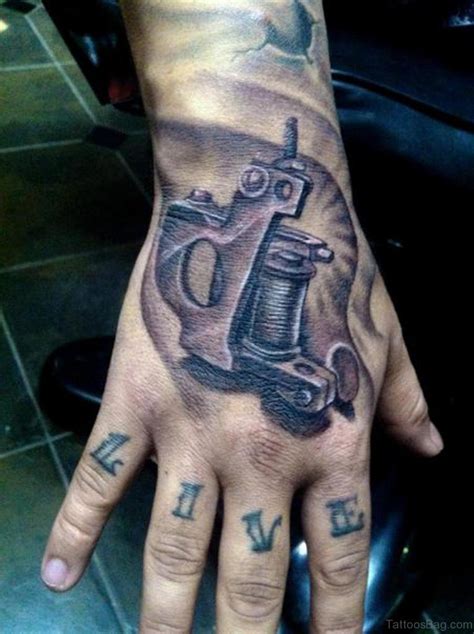 28 Funky Gun Tattoos On Hand Tattoo Designs