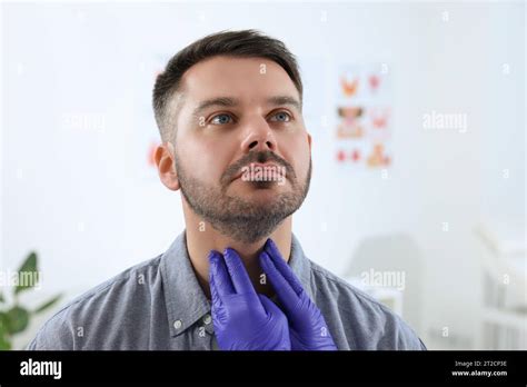 Endocrinologist Examining Thyroid Gland Of Patient At Hospital Closeup