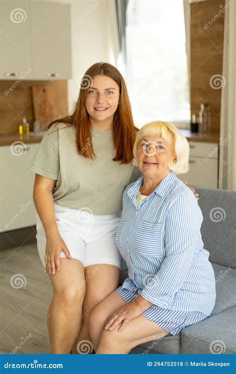 Happy Senior Woman Enjoying In Daughter S Affection On Mother S Day