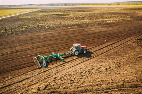 Premium Photo Aerial View Tractor Plowing Field Beginning Of