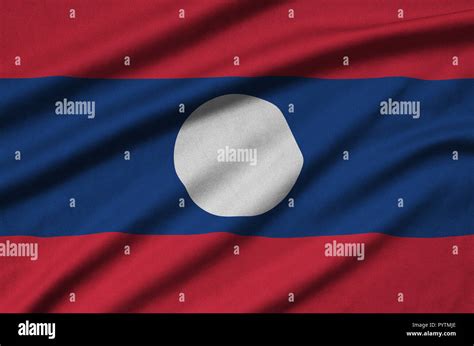 Laos Flag Is Depicted On A Sports Cloth Fabric With Many Folds Sport