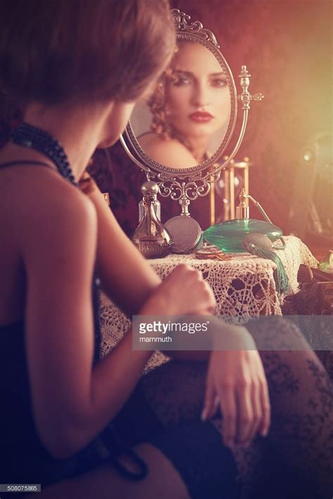 Young Woman Looking At Herself In The Mirror Looking For Women Her