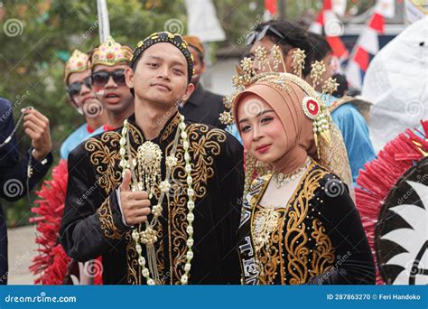 A Man and a Woman Wearing Traditional Javanese Wedding Clothes in Order ...