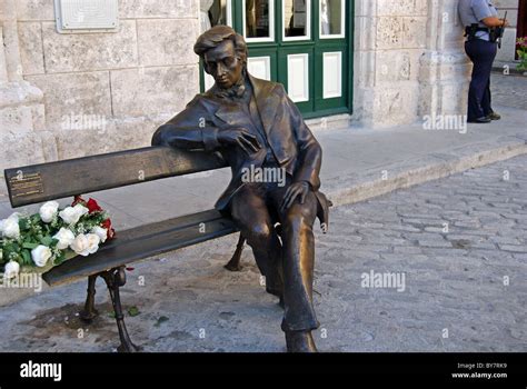 Bronze Statue Of Man Sitting On Bench Celebrating Frederico Chopin