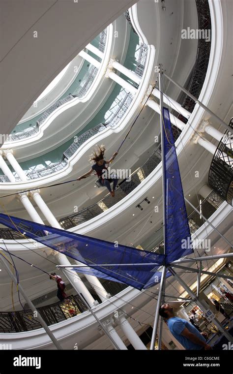 Bungee jumping inside Whiteley's of Queensway in London Stock Photo - Alamy