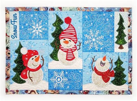 Three Snowmen With Hats And Scarfs Are Depicted In This Quilted